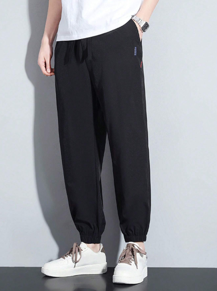Men Drawstring Waist Slant Pocket Carrot Pants